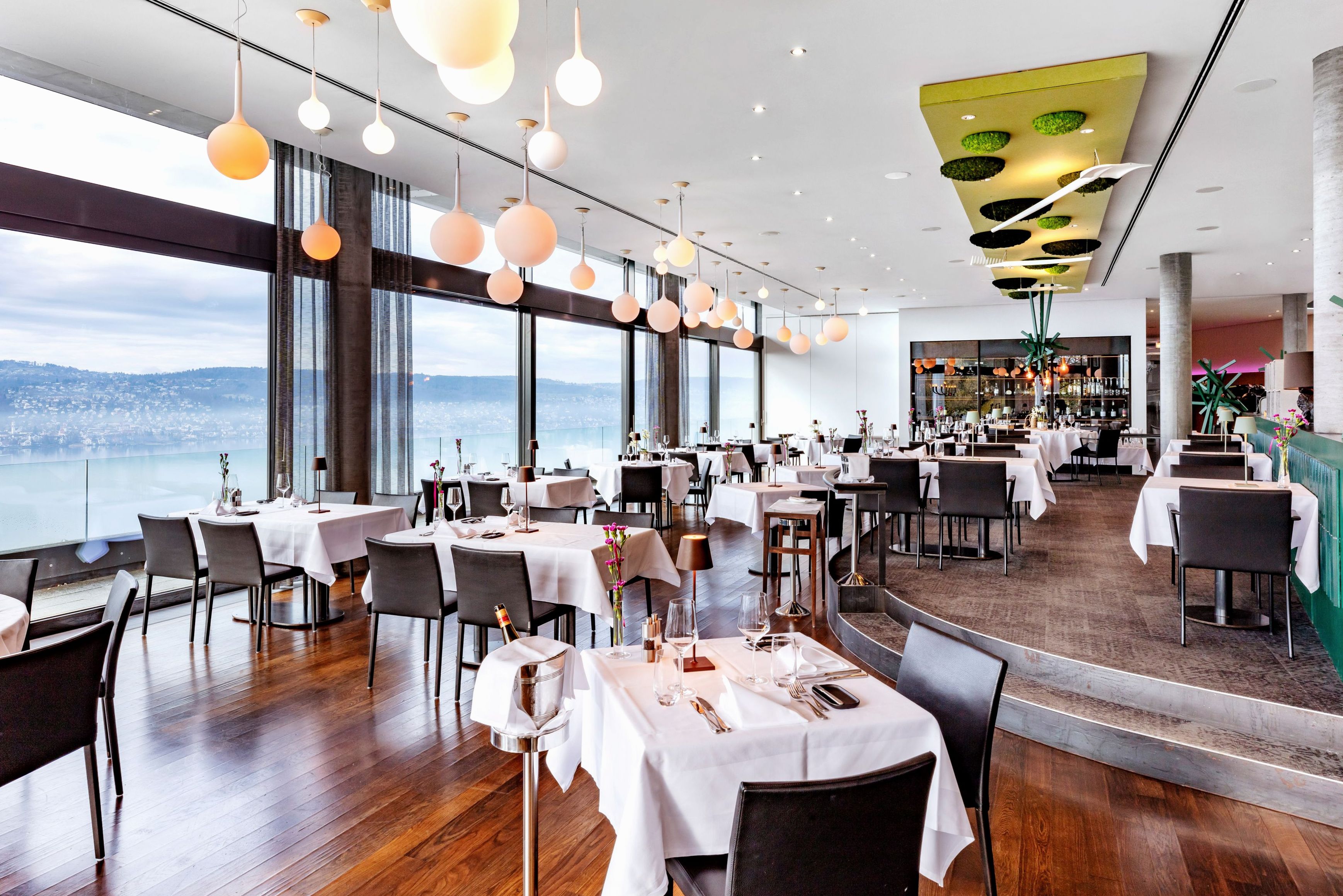 Fine dining restaurant with elegant table settings and warm lighting